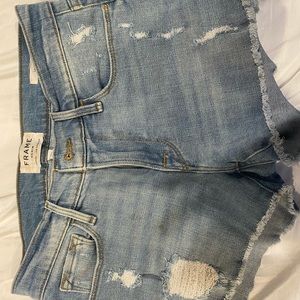 Jean Shorts. Light blue. Never worn. Gold button.